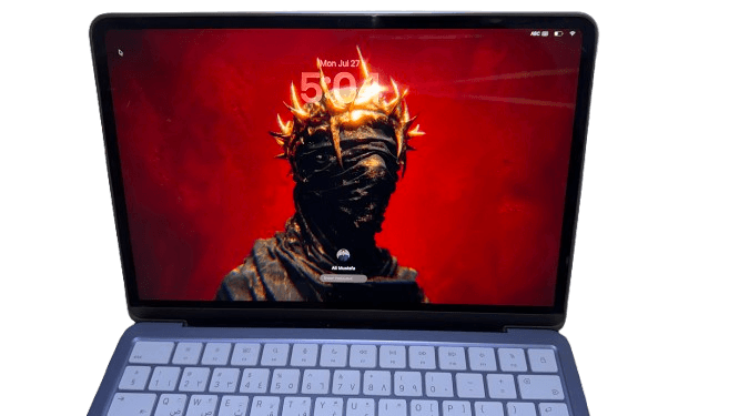 Apple MacBook Neo displaying the macOS lock screen with the 13-inch Liquid Retina display